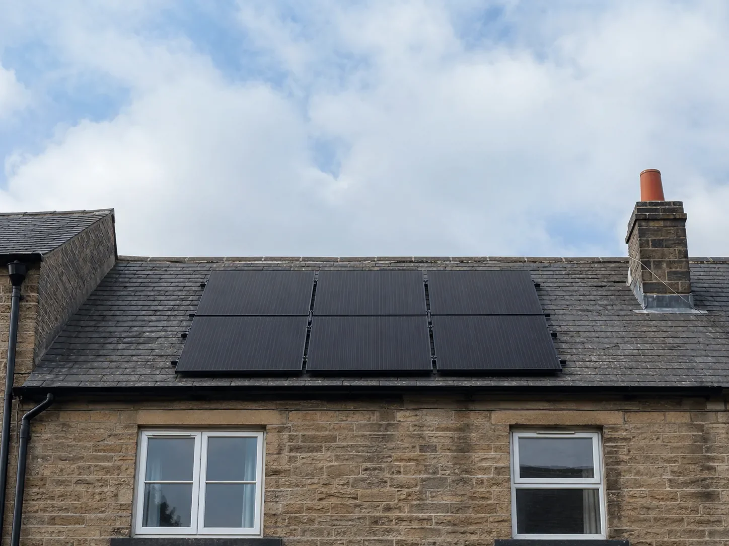 Solar panels on the slate roof of a Yorkshire stone house